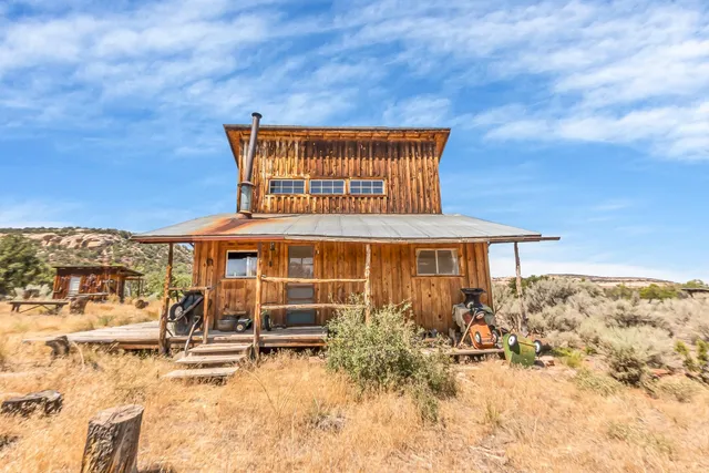 a view of a house with wooden walls