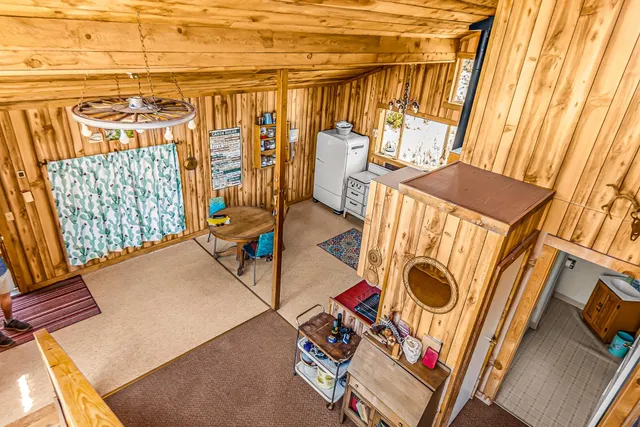 a bathroom with a sink a window and a shower