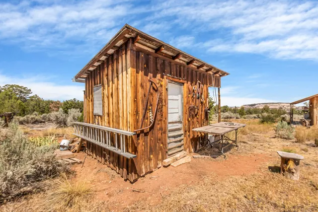 a view of a house with a yard covered with snow in the background