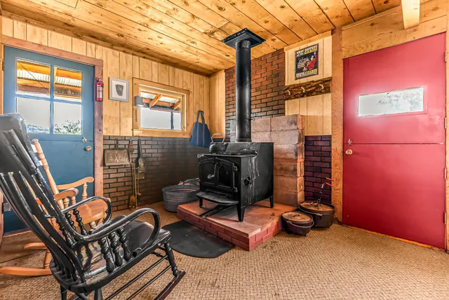 a view of a chairs and table in the balcony