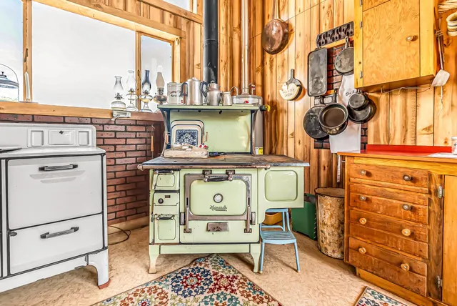 a view of a kitchen with a stove and a window
