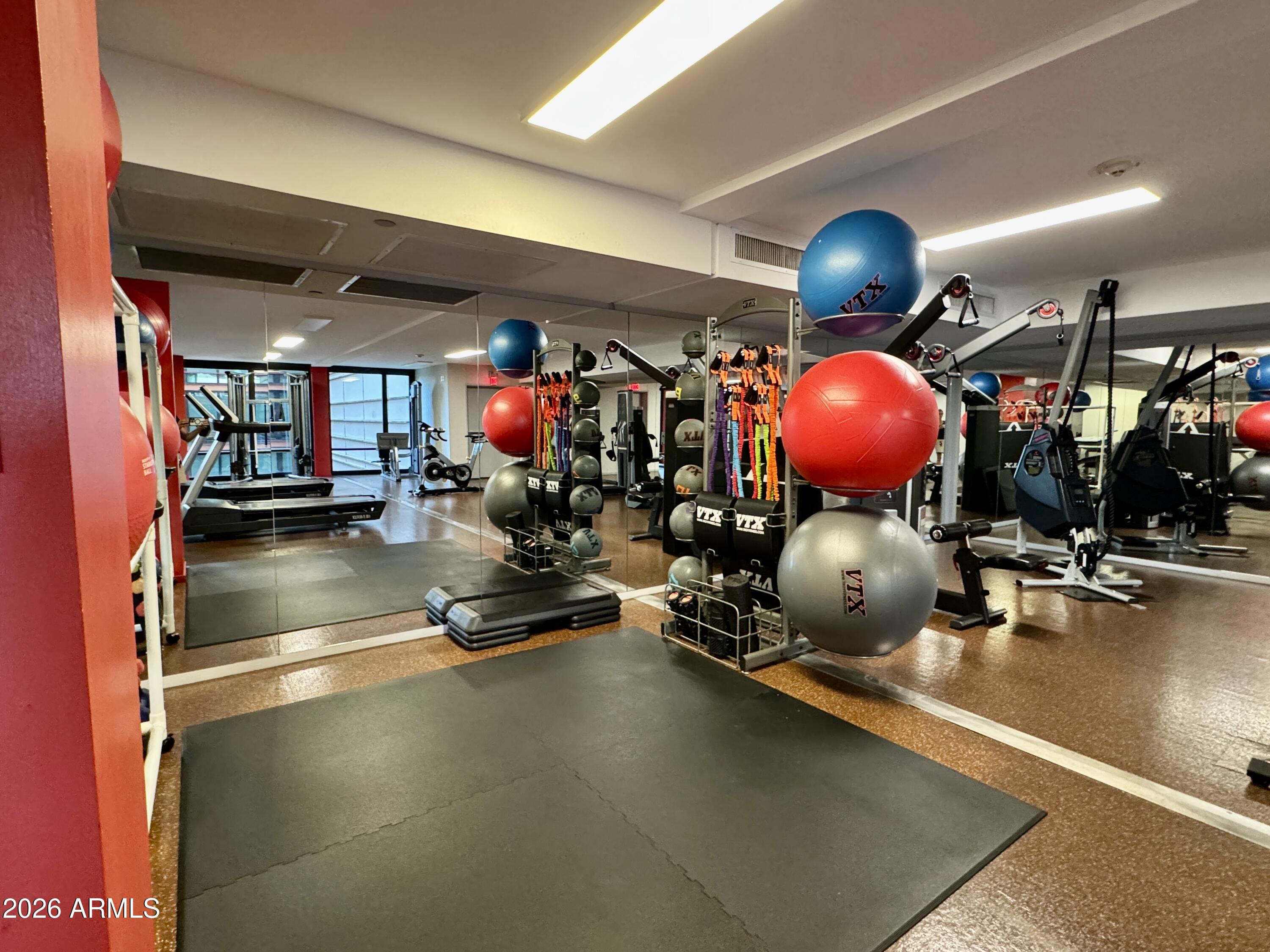 4808 North 24th Street, Unit 1102 Phoenix, AZ 85016 - Photo 14 of 20 a room with gym equipment