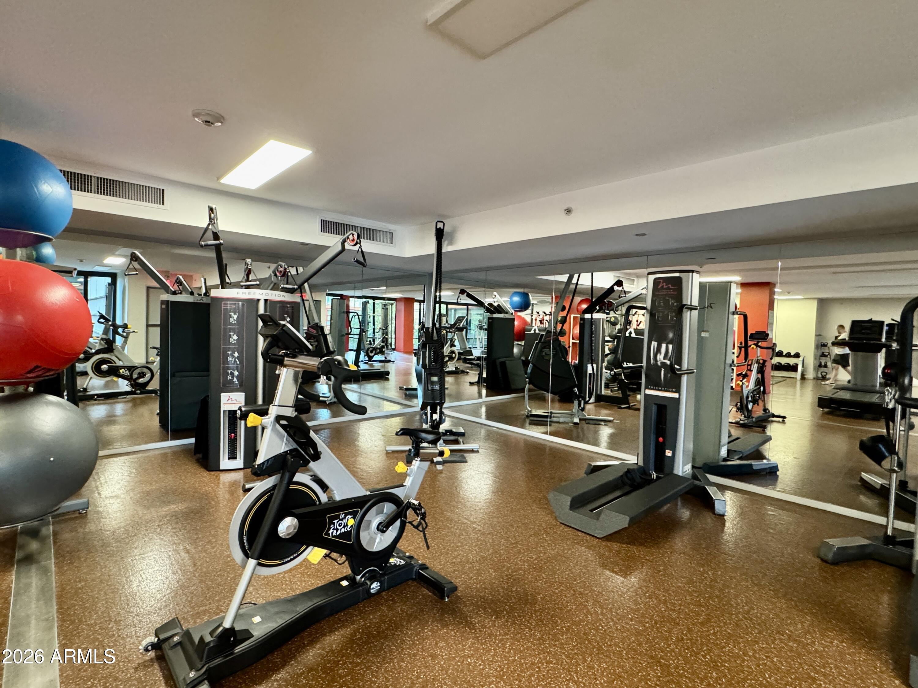4808 North 24th Street, Unit 1102 Phoenix, AZ 85016 - Photo 17 of 20 a view of a room with gym equipment