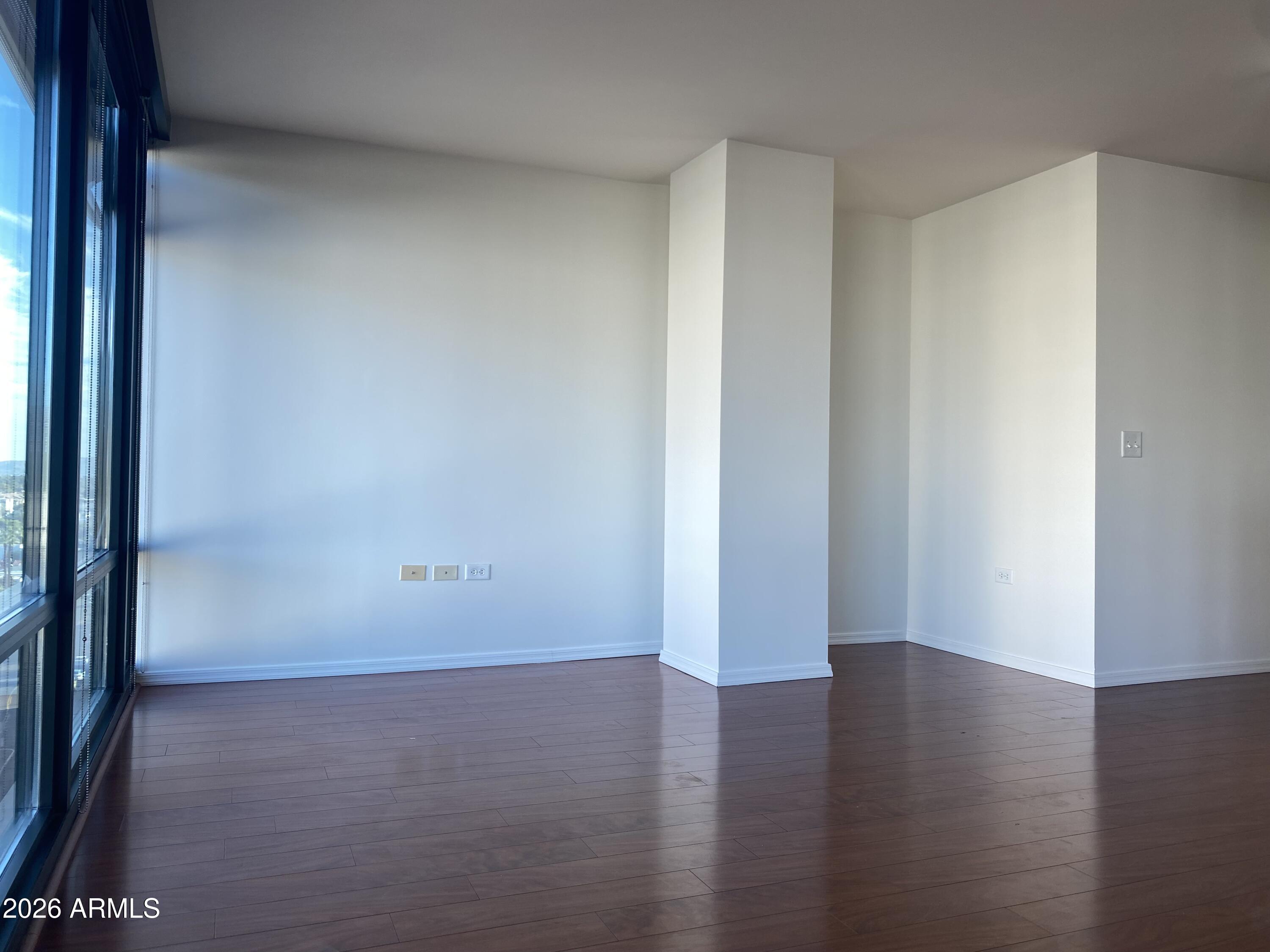 4808 North 24th Street, Unit 1102 Phoenix, AZ 85016 - Photo 4 of 20 a view of a room with wooden floor