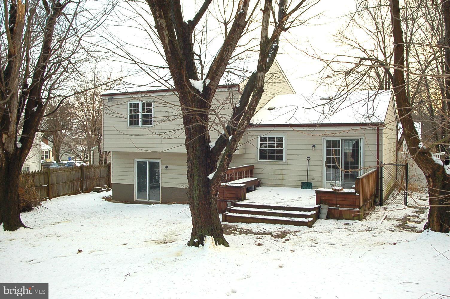 111 Applecreek Road Frederick, MD 21702 - Photo 3 of 21 a front view of a house with a yard covered in snow