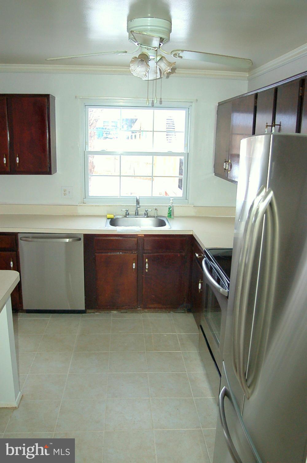 111 Applecreek Road Frederick, MD 21702 - Photo 7 of 21 a kitchen with stainless steel appliances granite countertop a refrigerator and a sink