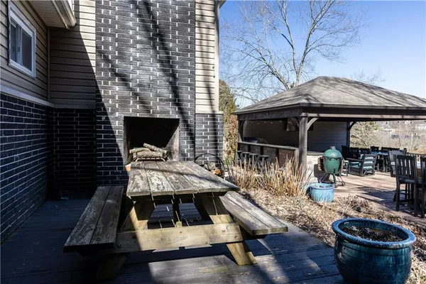a view of backyard of house with seating space