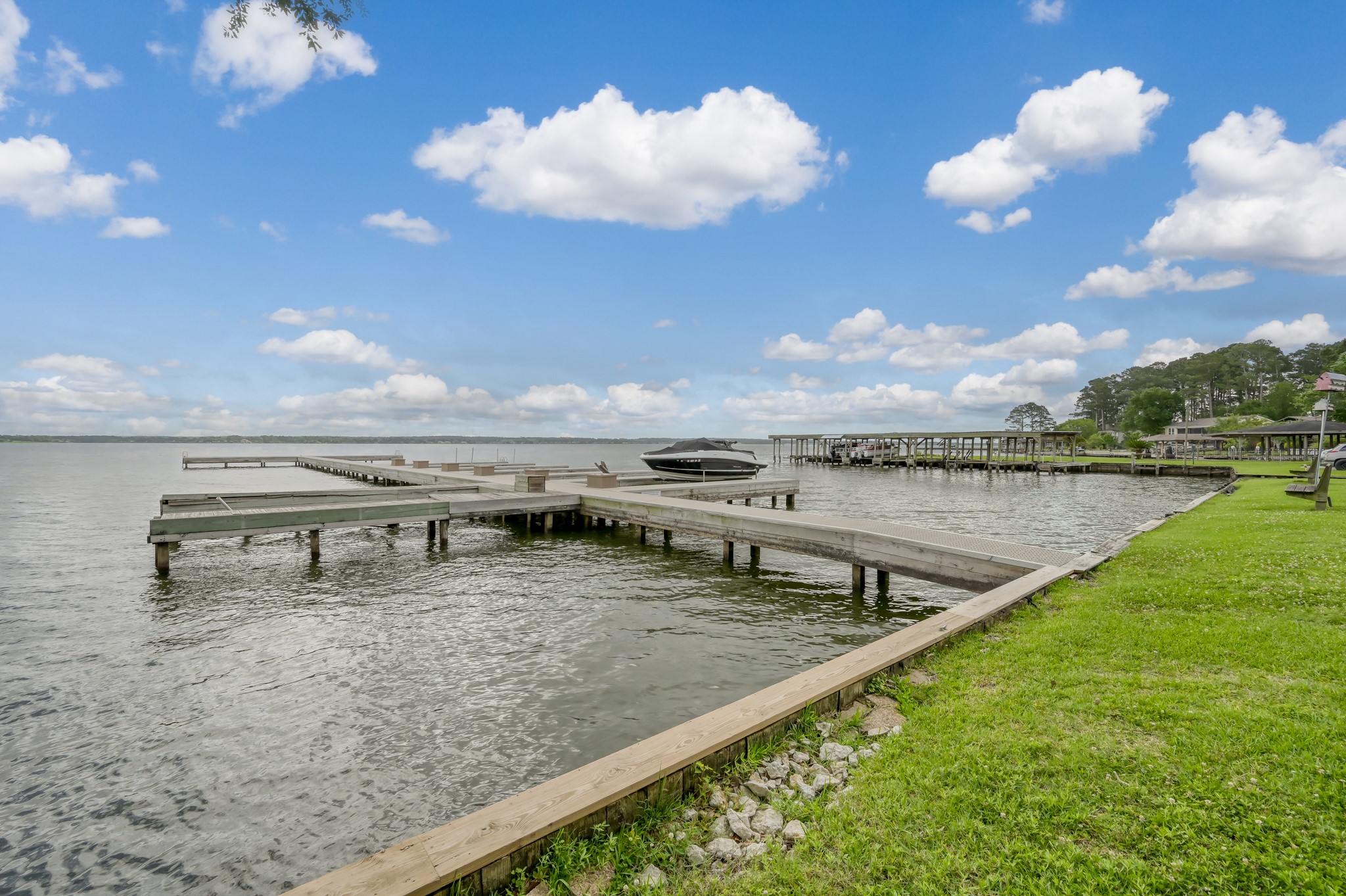 33 Regency Point Montgomery, TX 77356 - Photo 22 of 29 a view of a lake with a terrace
