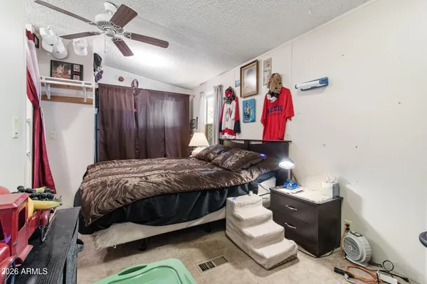 a bed room with a bed and a couch