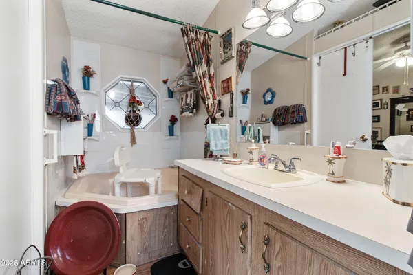 a bathroom with a sink vanity and mirror