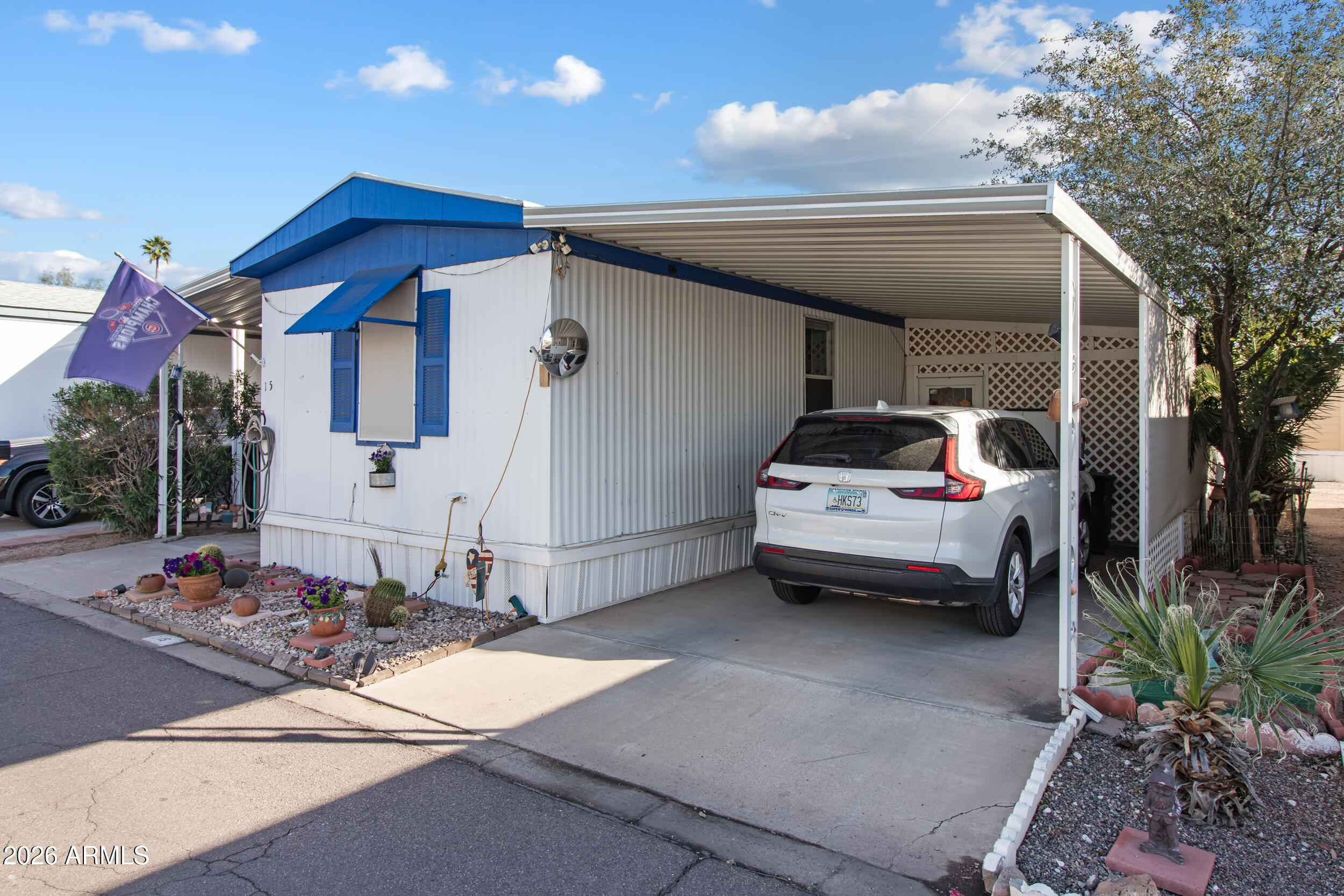 2121 North Center Street, Unit 15 Mesa, AZ 85201 - Photo 33 of 50 a car parked in front of a house