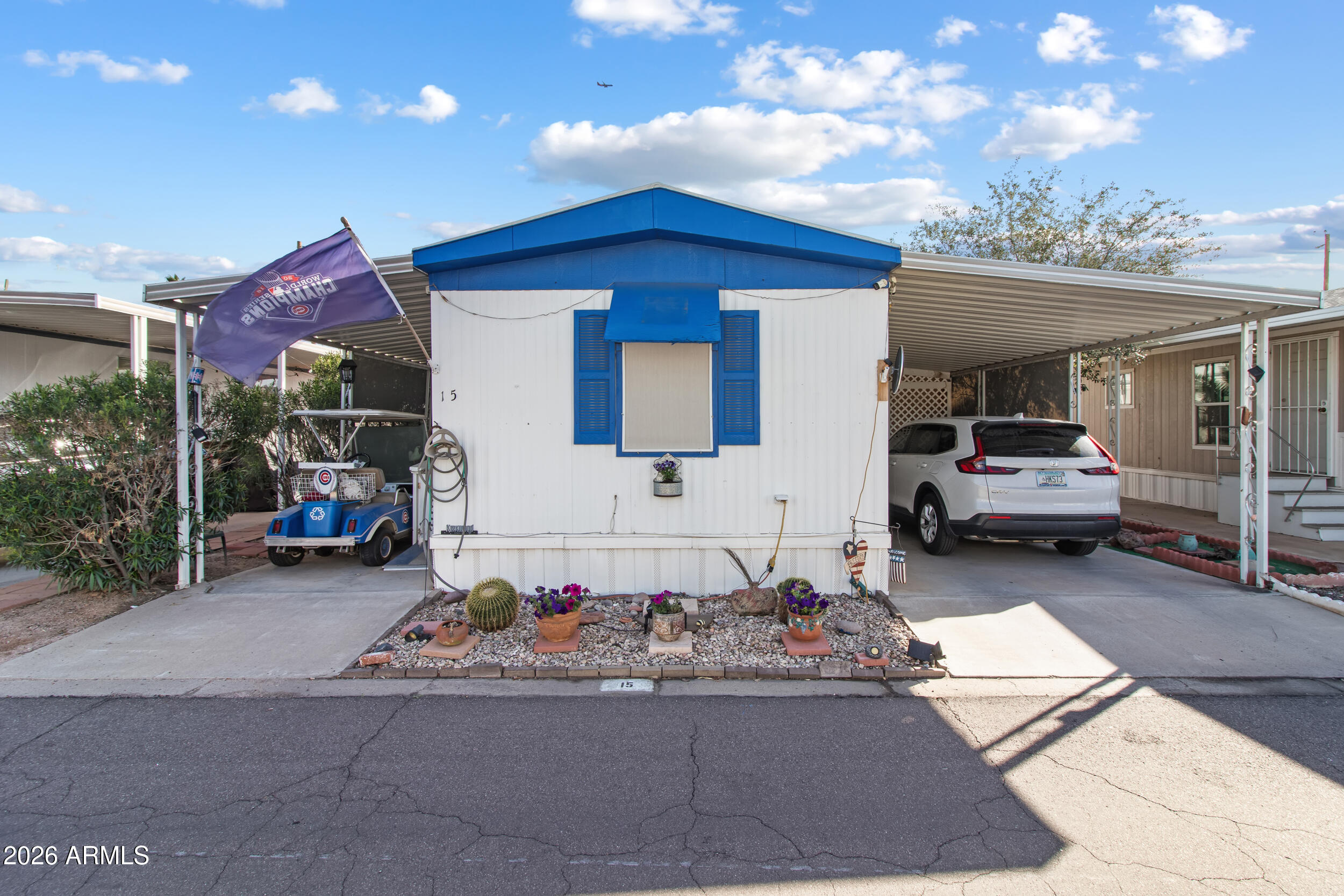2121 North Center Street, Unit 15 Mesa, AZ 85201 - Photo 34 of 50 a view of a car park in front of house