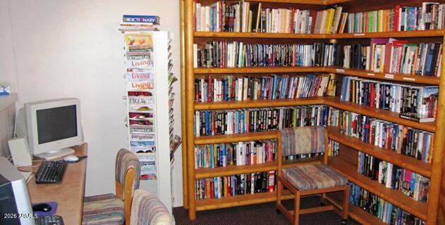 2121 North Center Street, Unit 15 Mesa, AZ 85201 - Photo 40 of 50 a bookshelf with wooden floor in a book shelf