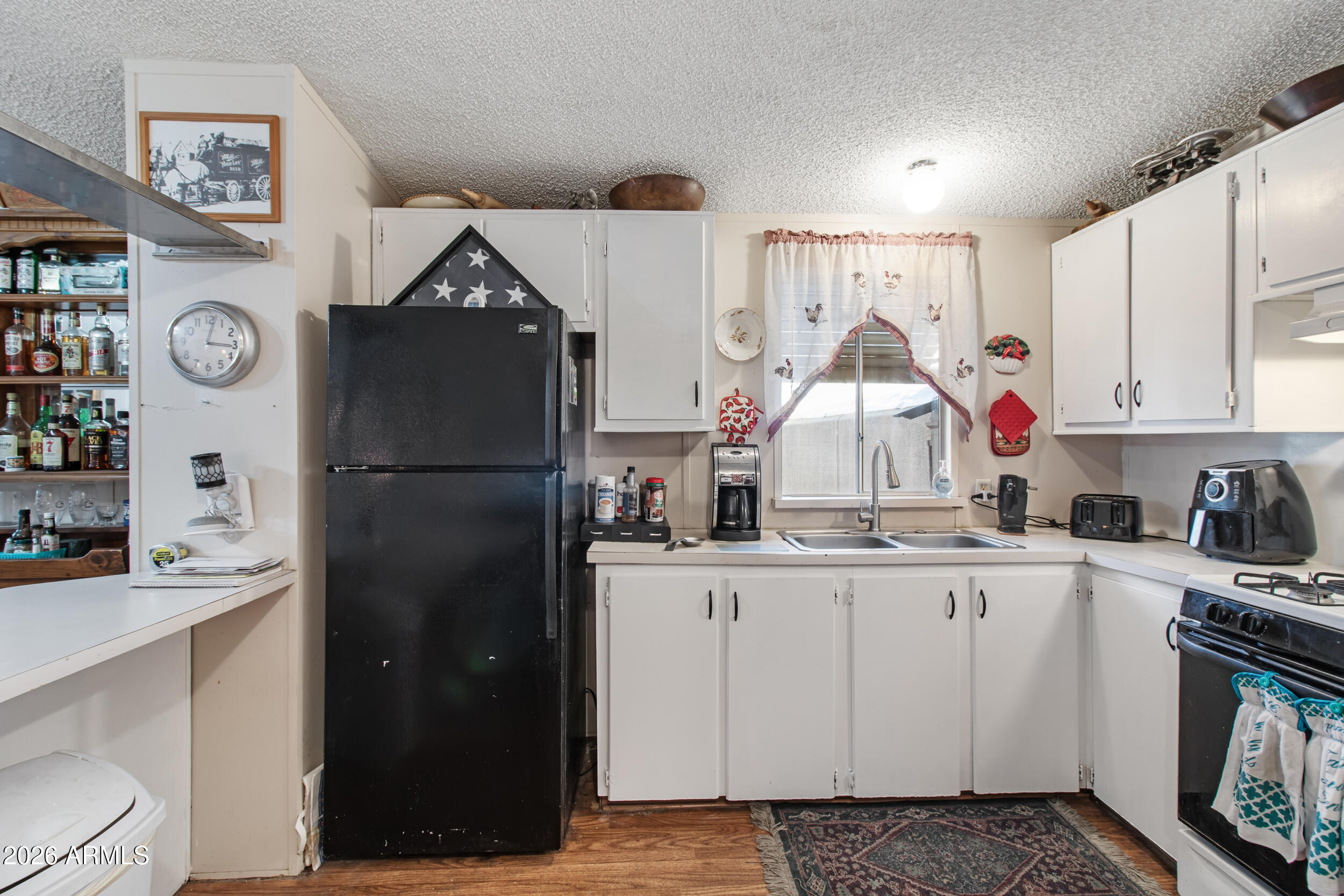 2121 North Center Street, Unit 15 Mesa, AZ 85201 - Photo 9 of 50 a kitchen with stainless steel appliances granite countertop a refrigerator and a stove
