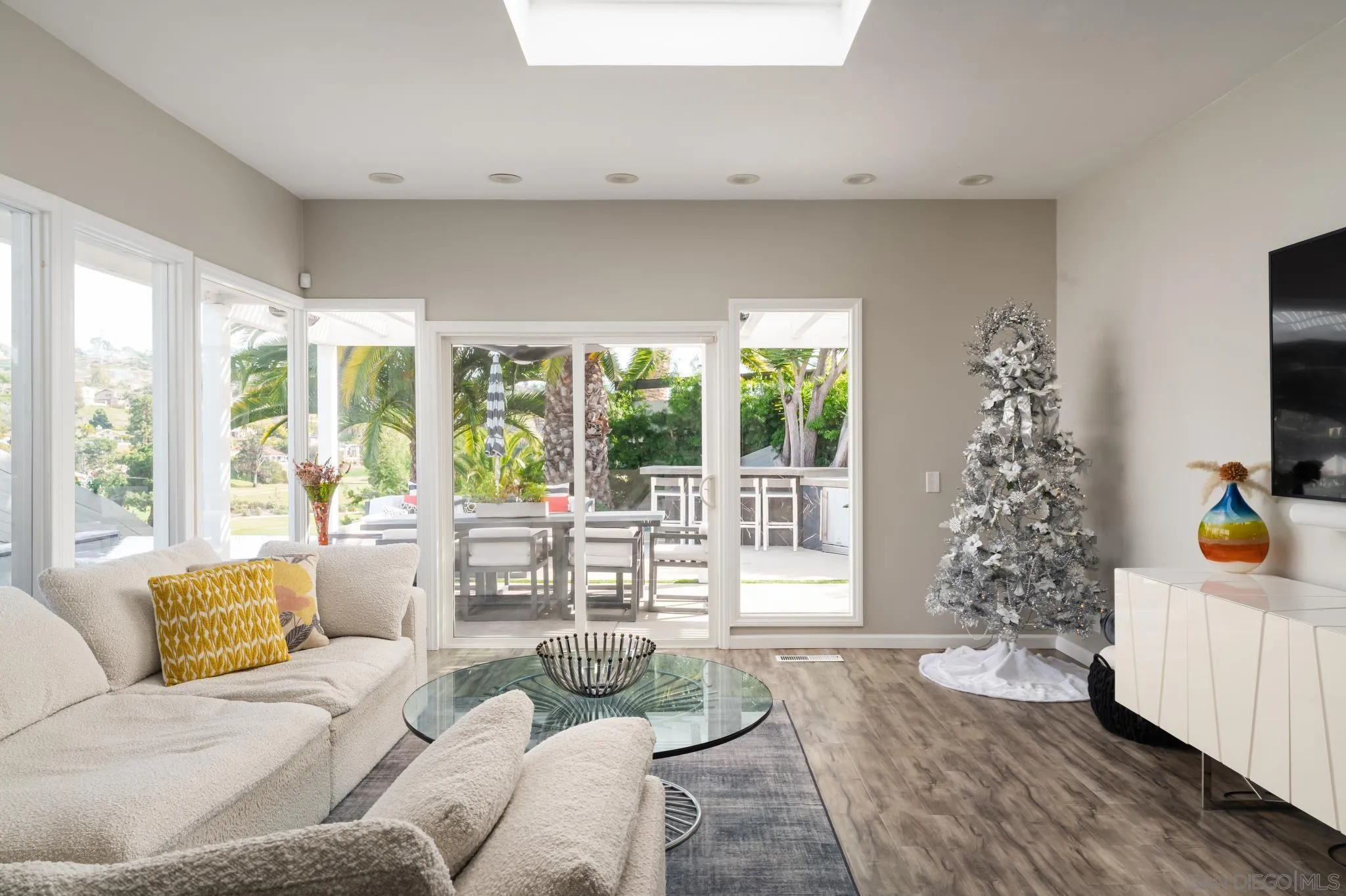 7026 Estrella De Mar Road Carlsbad, CA 92009 - Photo 18 of 46 a living room with furniture and a large window