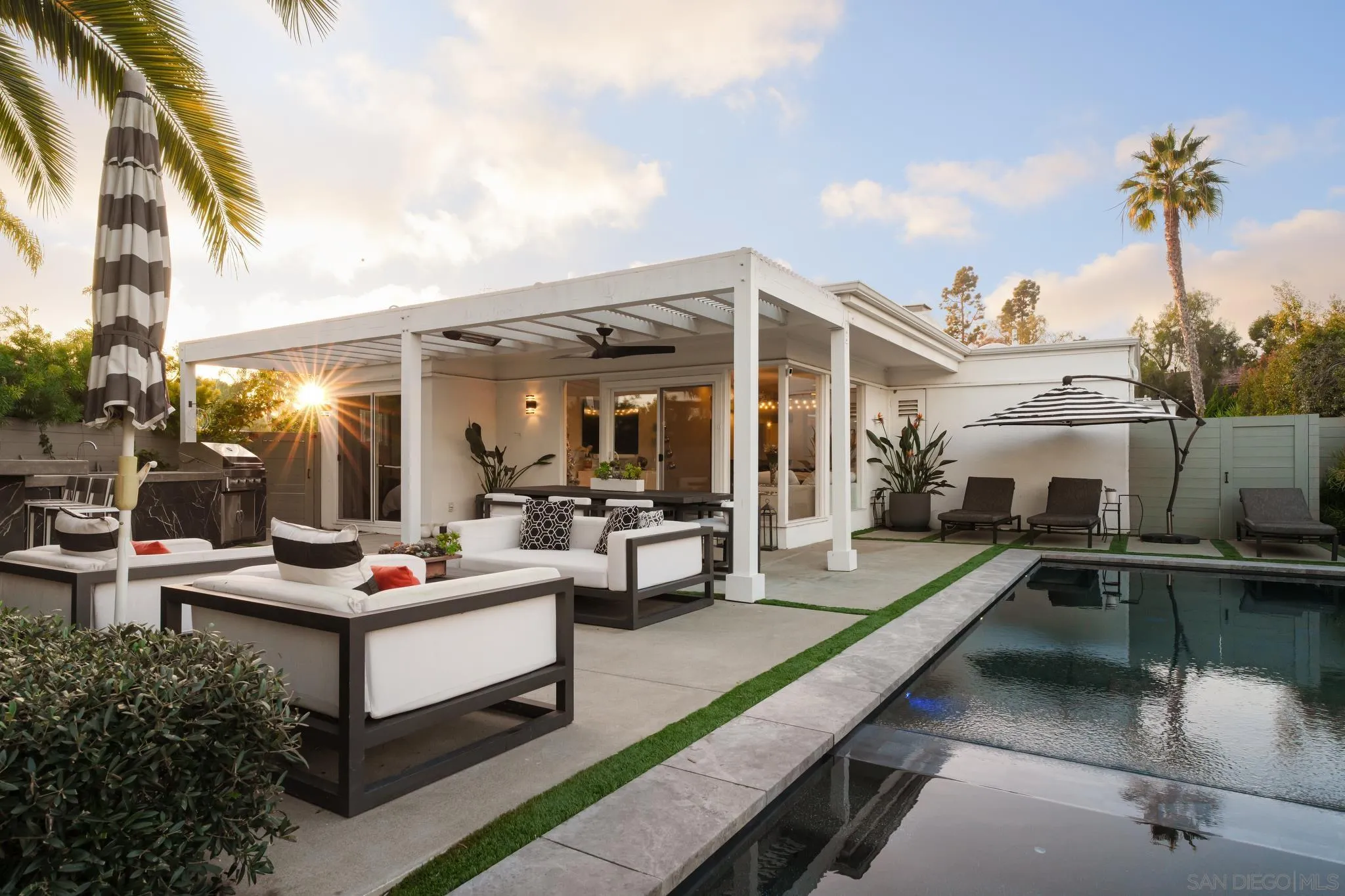 7026 Estrella De Mar Road Carlsbad, CA 92009 - Photo 26 of 46 a view of a patio with couches table and chairs and potted plants