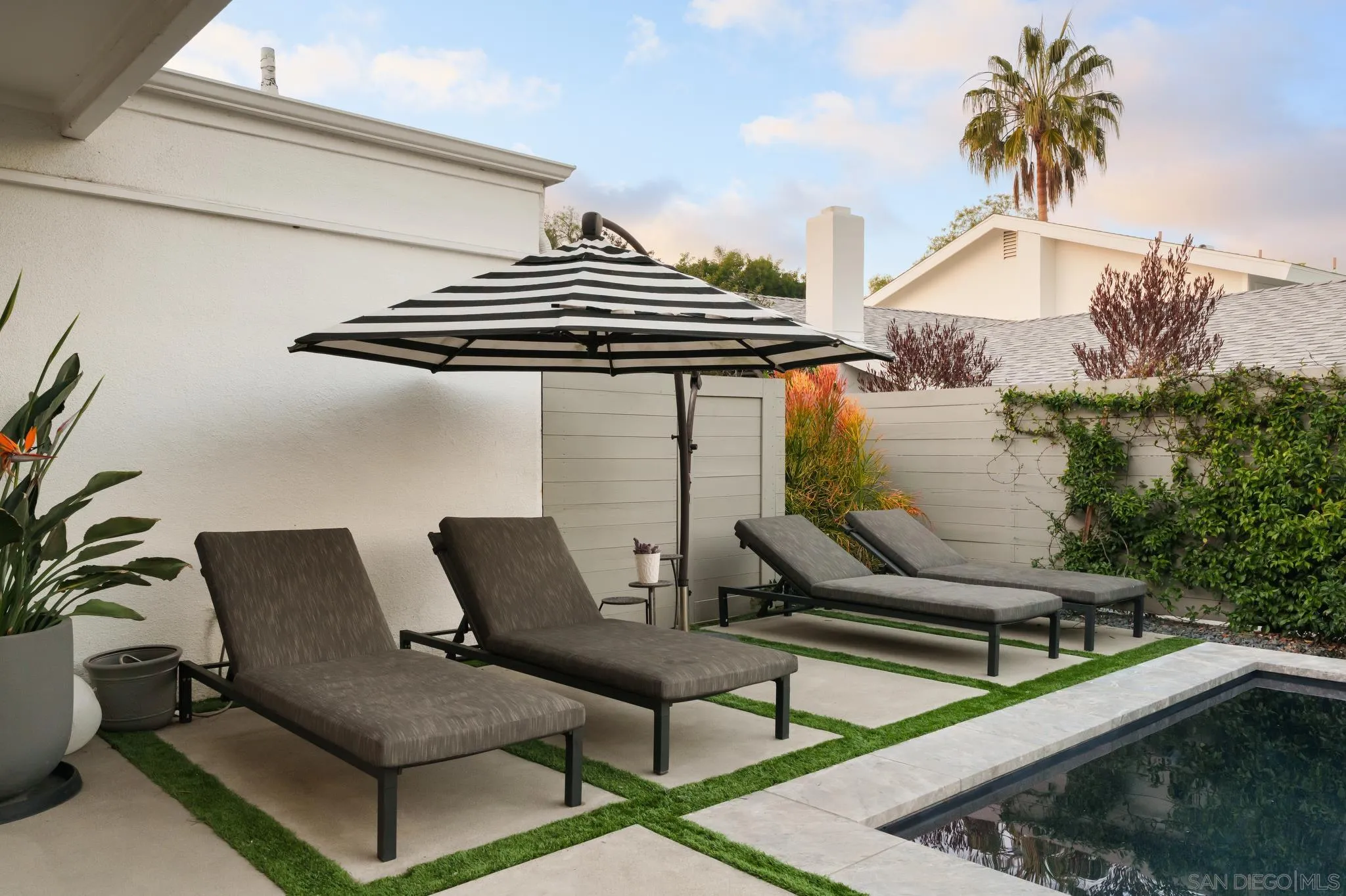 7026 Estrella De Mar Road Carlsbad, CA 92009 - Photo 27 of 46 a couple of chairs sitting in front of a building