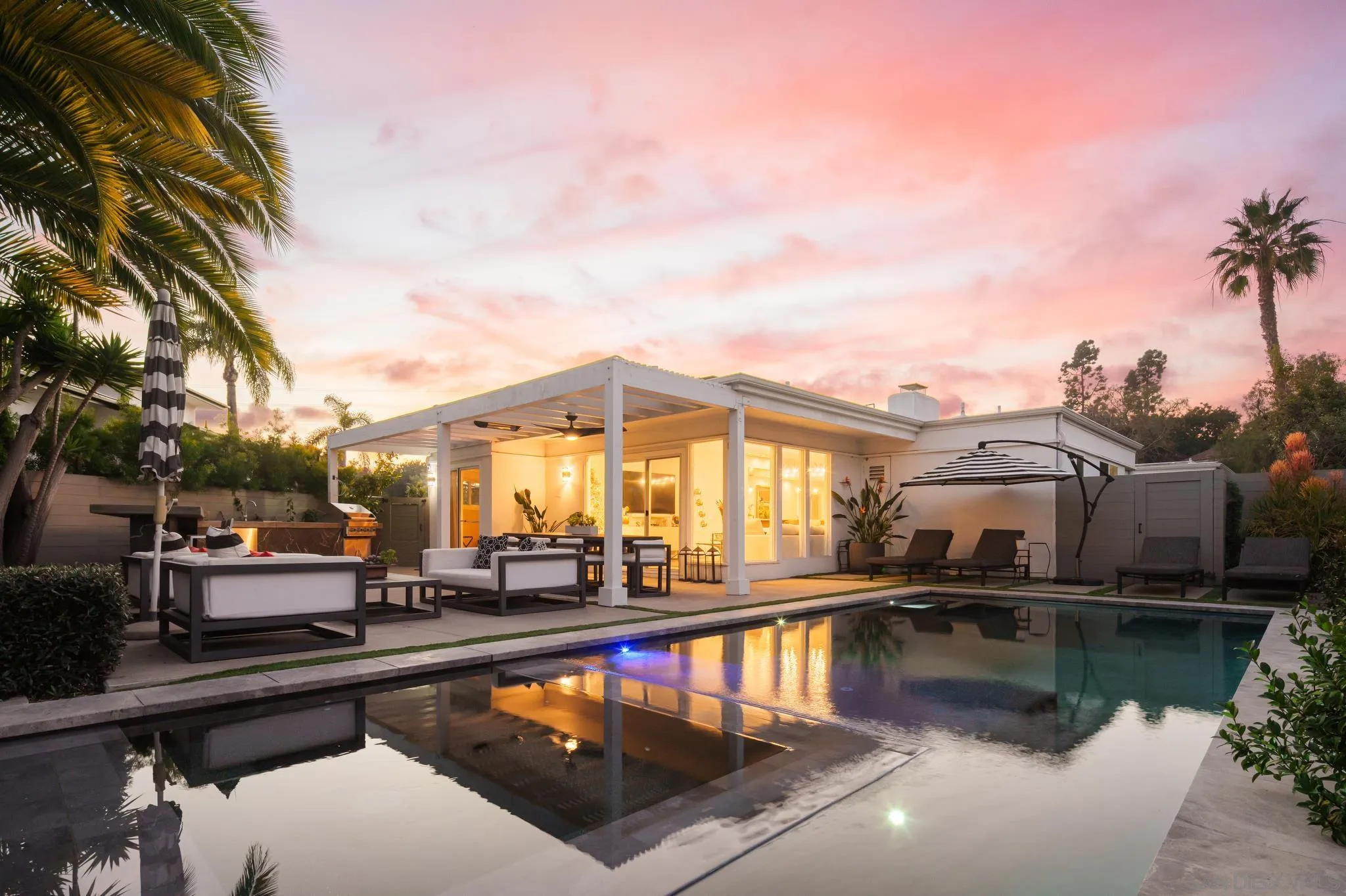 7026 Estrella De Mar Road Carlsbad, CA 92009 - Photo 32 of 46 a view of a swimming pool with a lounge chairs