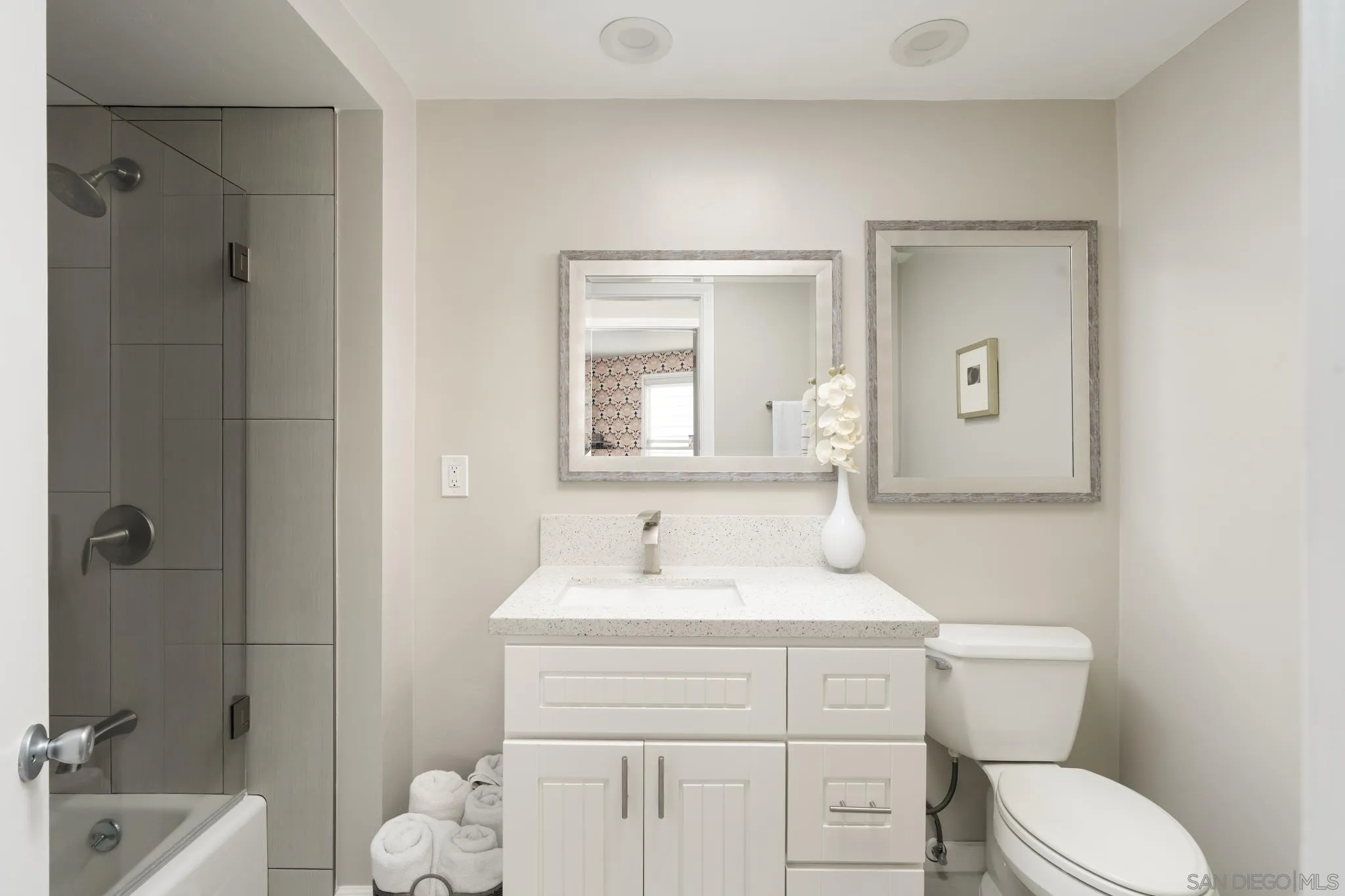 7026 Estrella De Mar Road Carlsbad, CA 92009 - Photo 38 of 46 a bathroom with a toilet sink vanity tub and mirror