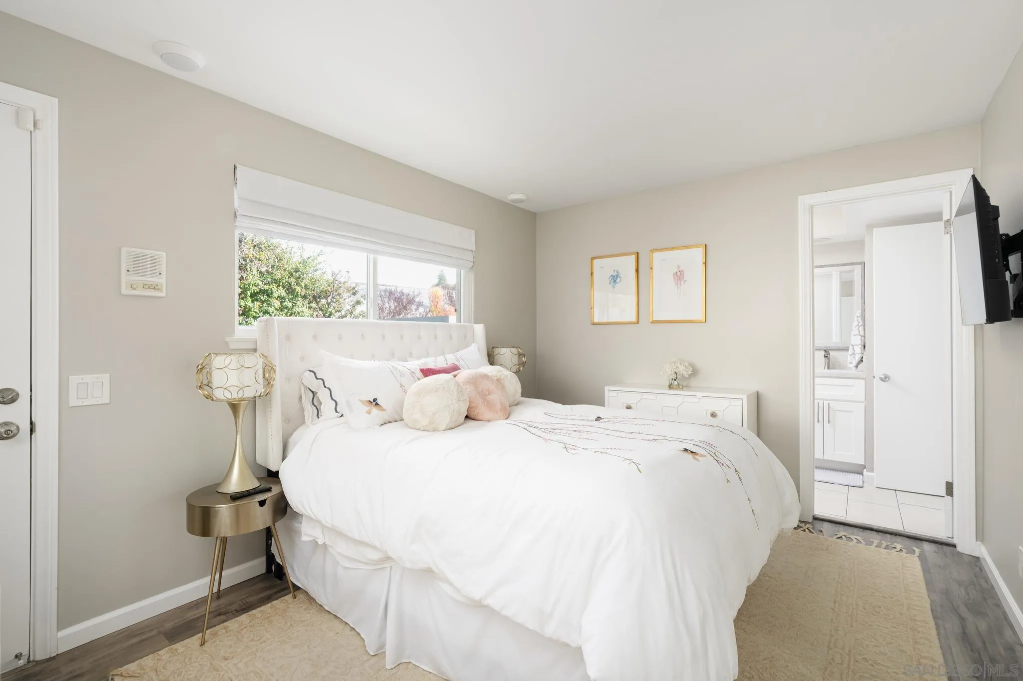 7026 Estrella De Mar Road Carlsbad, CA 92009 - Photo 39 of 46 a bedroom with a bed and a window