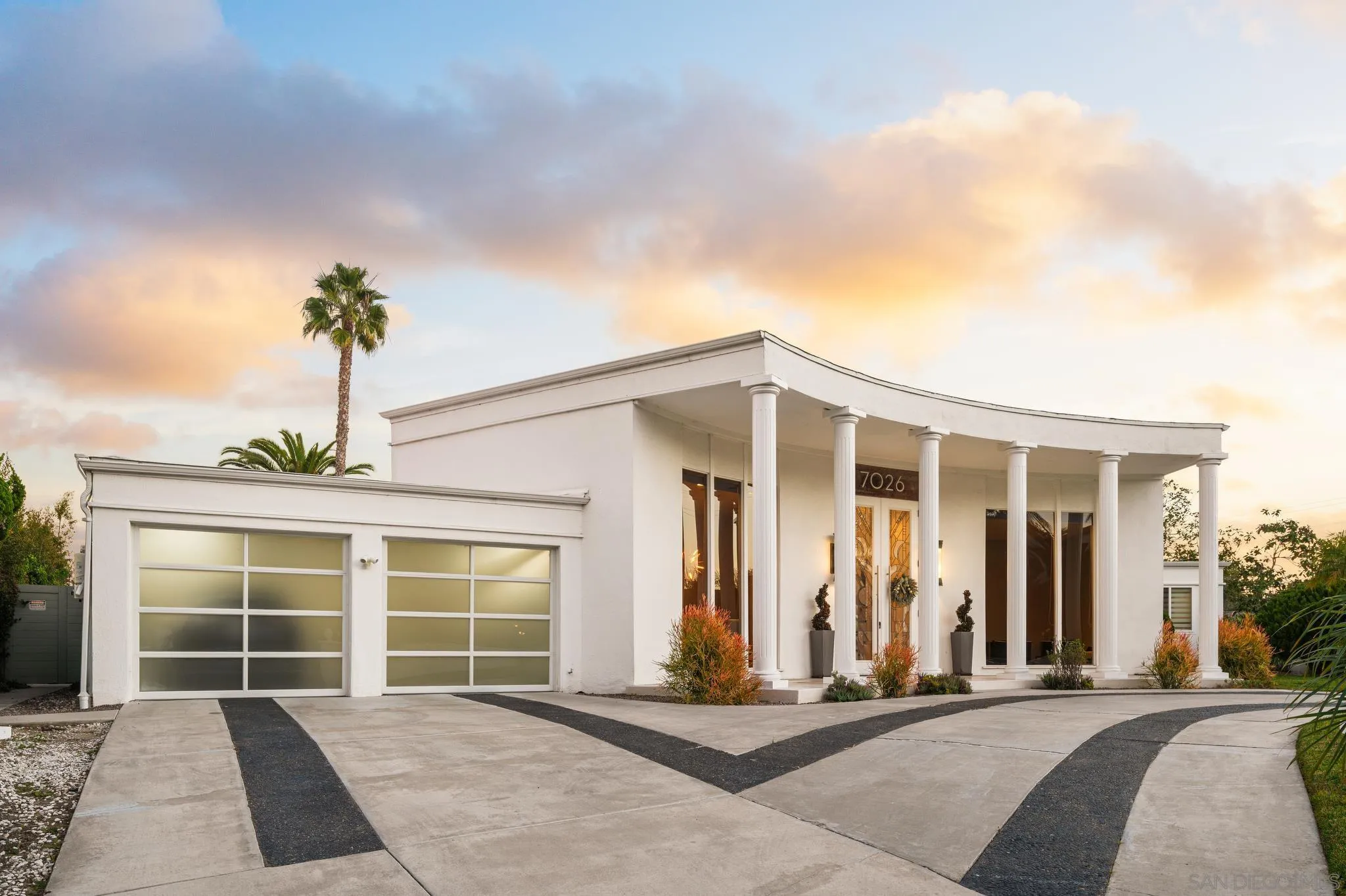 7026 Estrella De Mar Road Carlsbad, CA 92009 - Photo 4 of 46 a front view of a house with a yard