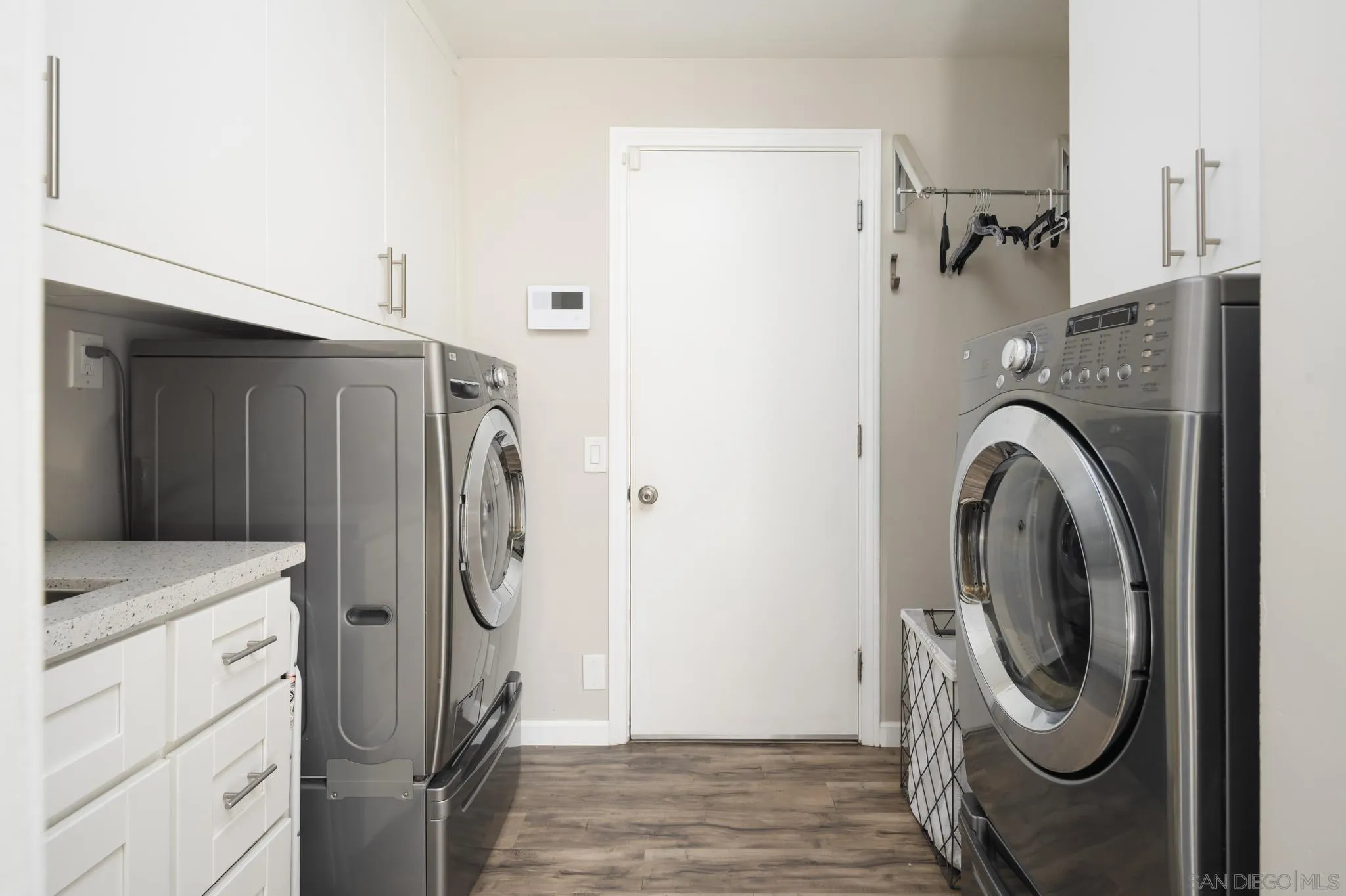 7026 Estrella De Mar Road Carlsbad, CA 92009 - Photo 41 of 46 a utility room with dryer and washer