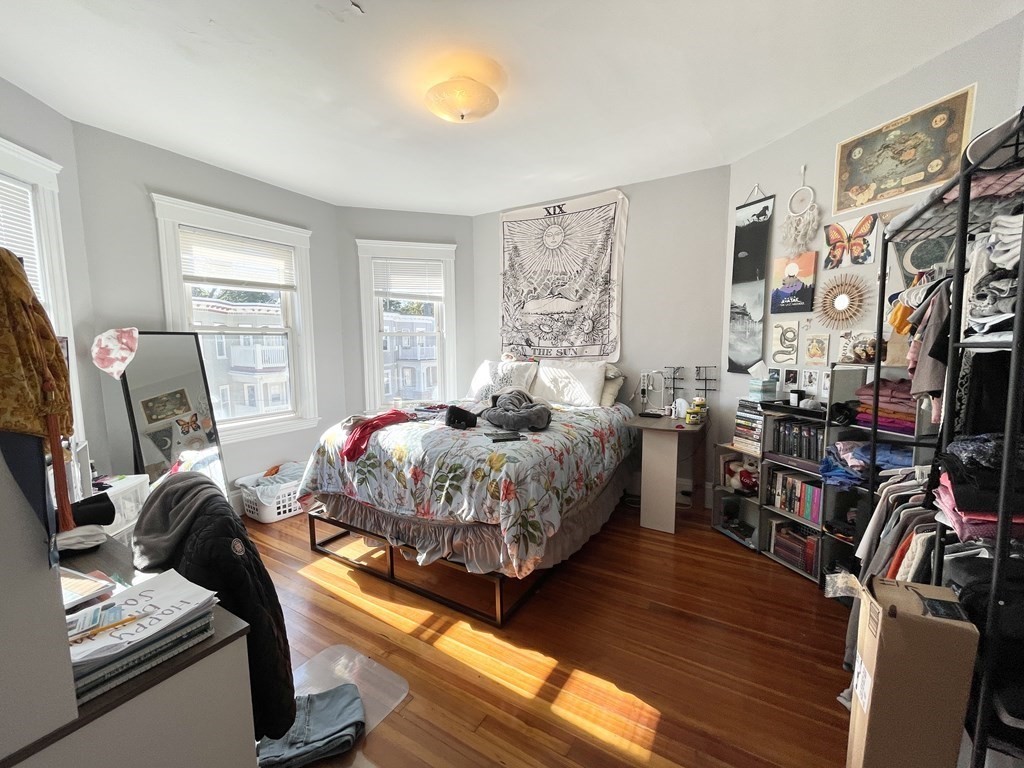 9 Taft Street, Unit 3 Boston, MA 02125 - Photo 5 of 10 a bedroom with bed and wooden floor