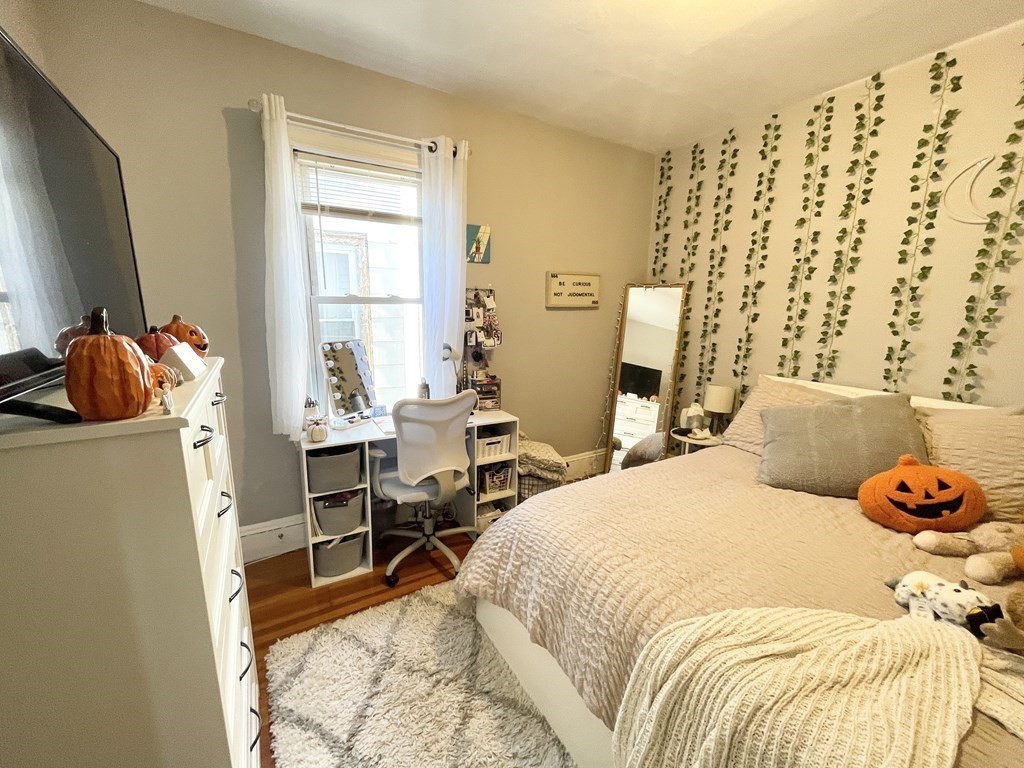 9 Taft Street, Unit 3 Boston, MA 02125 - Photo 6 of 10 a bedroom with a bed and a window