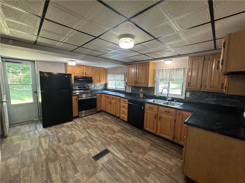 375 Browns Hill Road Valencia, PA 16059 - Photo 22 of 22 a kitchen with stainless steel appliances granite countertop a refrigerator a sink a stove a microwave and cabinets