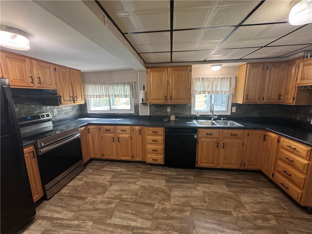 375 Browns Hill Road Valencia, PA 16059 - Photo 4 of 22 a large kitchen with granite countertop a stove cabinets and sink