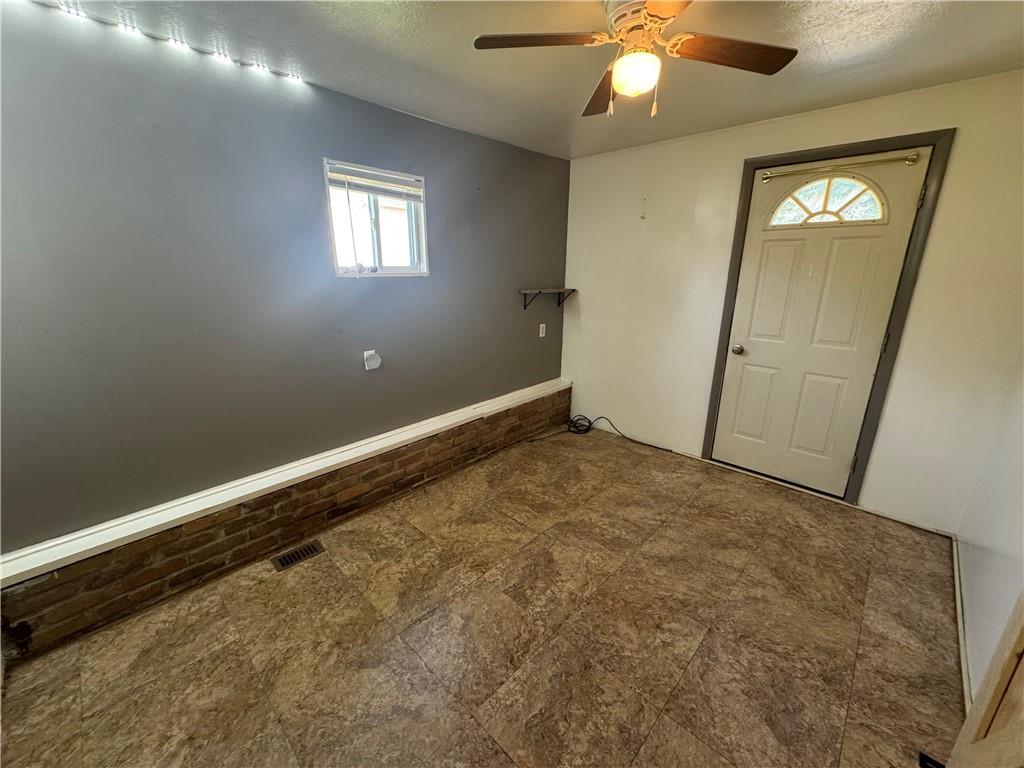 375 Browns Hill Road Valencia, PA 16059 - Photo 10 of 22 an empty room with windows and fan
