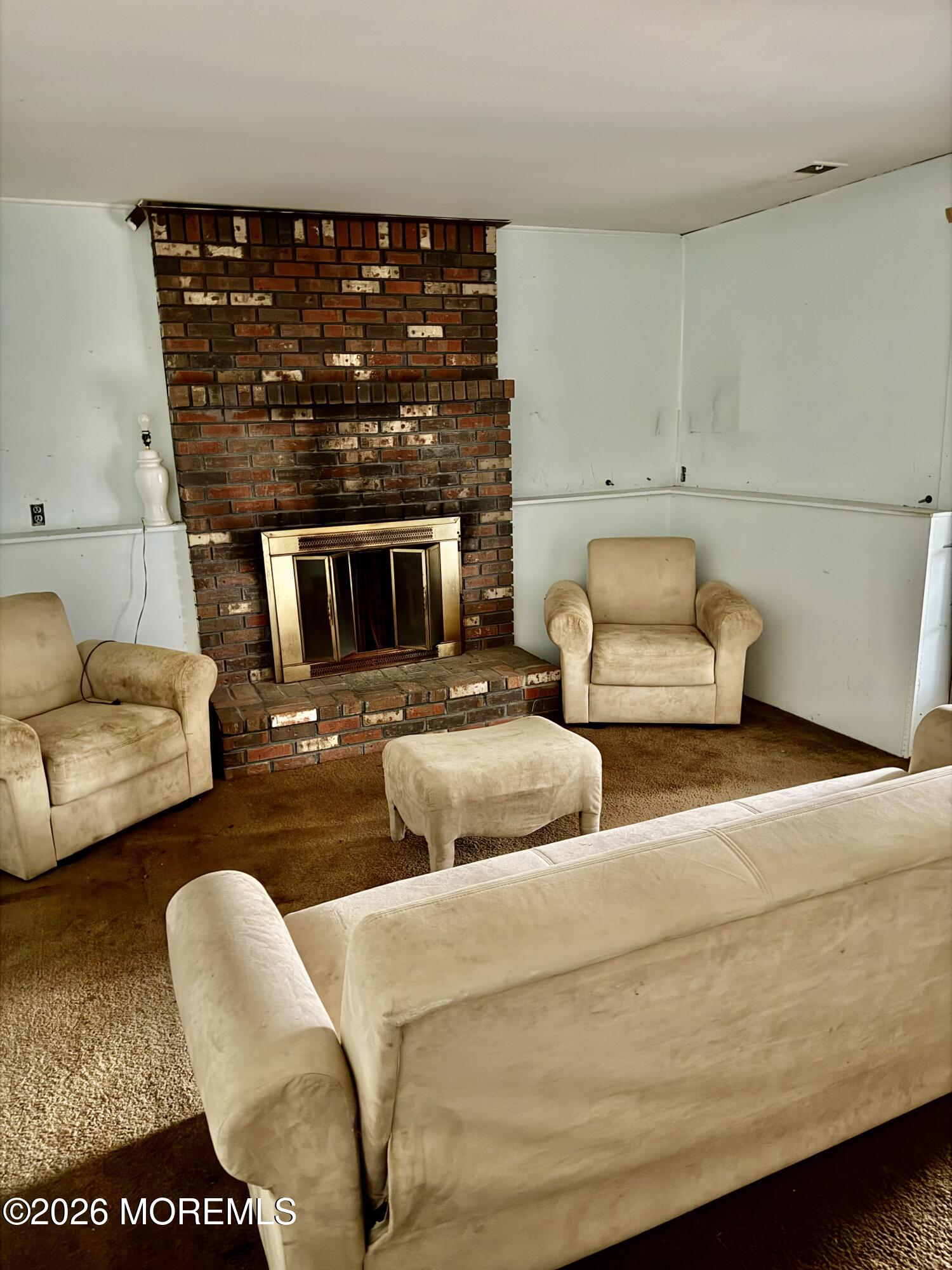 350 Bartley Road Jackson, NJ 08527 - Photo 24 of 29 a living room with furniture and a fireplace