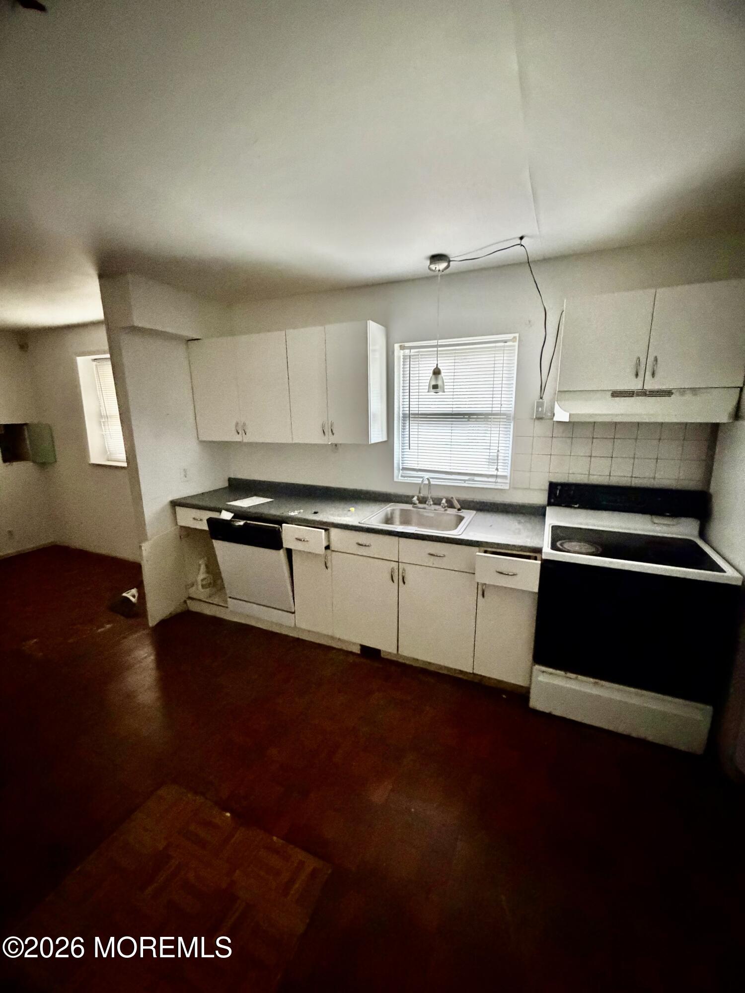 350 Bartley Road Jackson, NJ 08527 - Photo 27 of 29 a kitchen with stainless steel appliances granite countertop a stove a sink and a microwave
