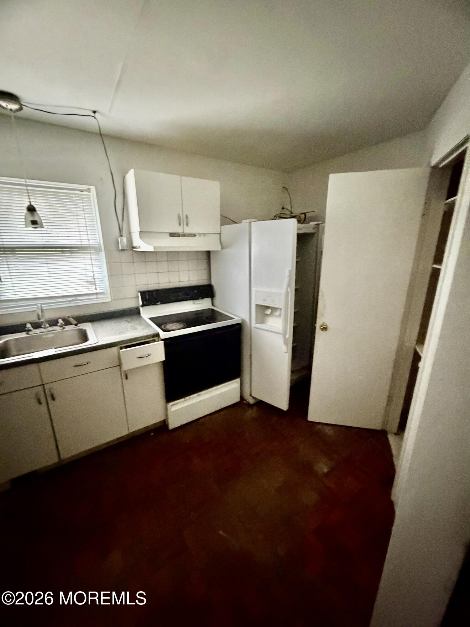 350 Bartley Road Jackson, NJ 08527 - Photo 28 of 29 a kitchen with granite countertop a refrigerator and a stove top oven