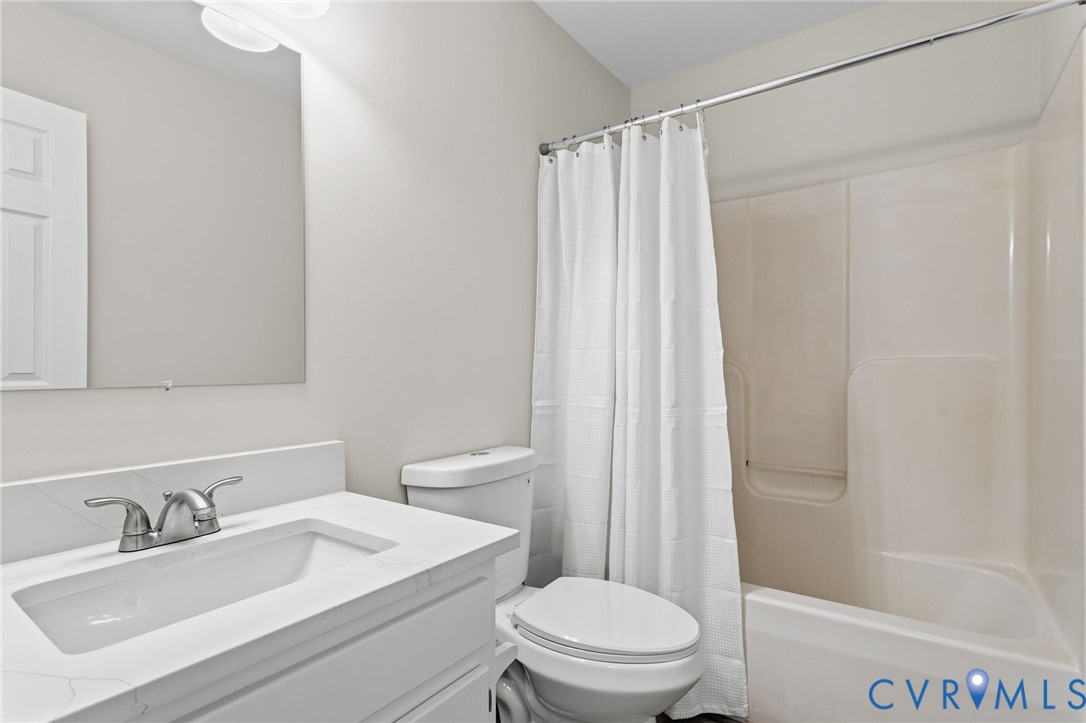 14624 Wilkinson Road Dewitt, VA 23840 - Photo 16 of 47 a bathroom with a sink a toilet and shower