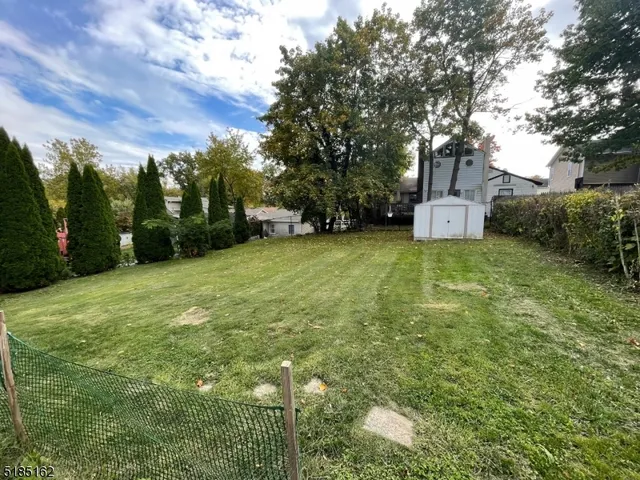 a view of a tree in front of a house