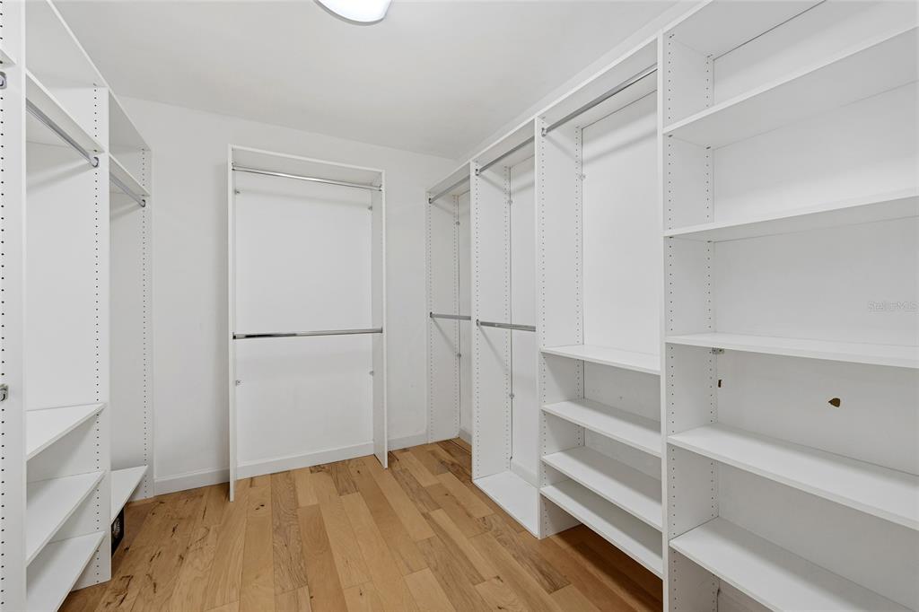 6206 Masters Boulevard, Unit 302 Orlando, FL 32819 - Photo 11 of 32 a view of walk in closet with empty racks