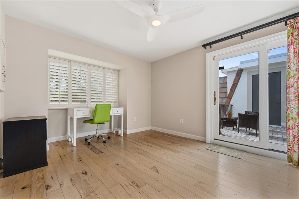 6206 Masters Boulevard, Unit 302 Orlando, FL 32819 - Photo 12 of 32 a workspace with furniture and a window