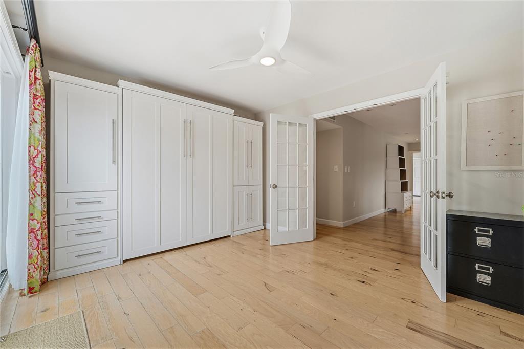 6206 Masters Boulevard, Unit 302 Orlando, FL 32819 - Photo 13 of 32 wooden floor in an empty room