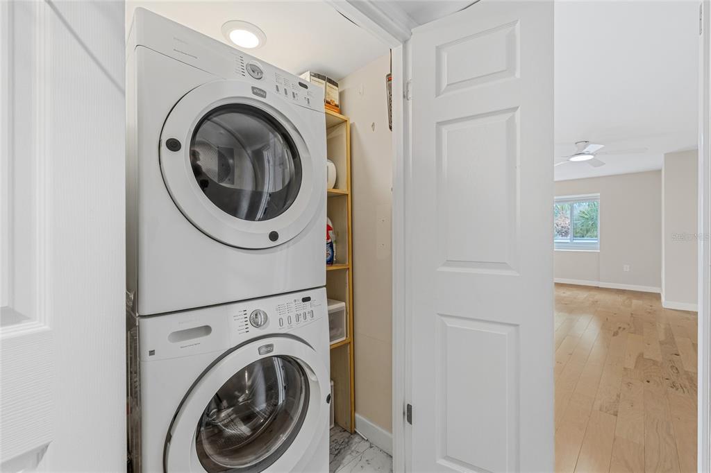 6206 Masters Boulevard, Unit 302 Orlando, FL 32819 - Photo 16 of 32 a view of a hallway with washer and dryer