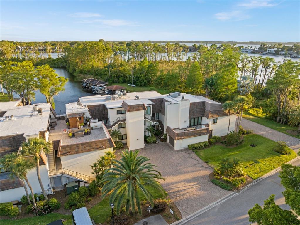 6206 Masters Boulevard, Unit 302 Orlando, FL 32819 - Photo 20 of 32 an aerial view of a house with garden space and outdoor seating