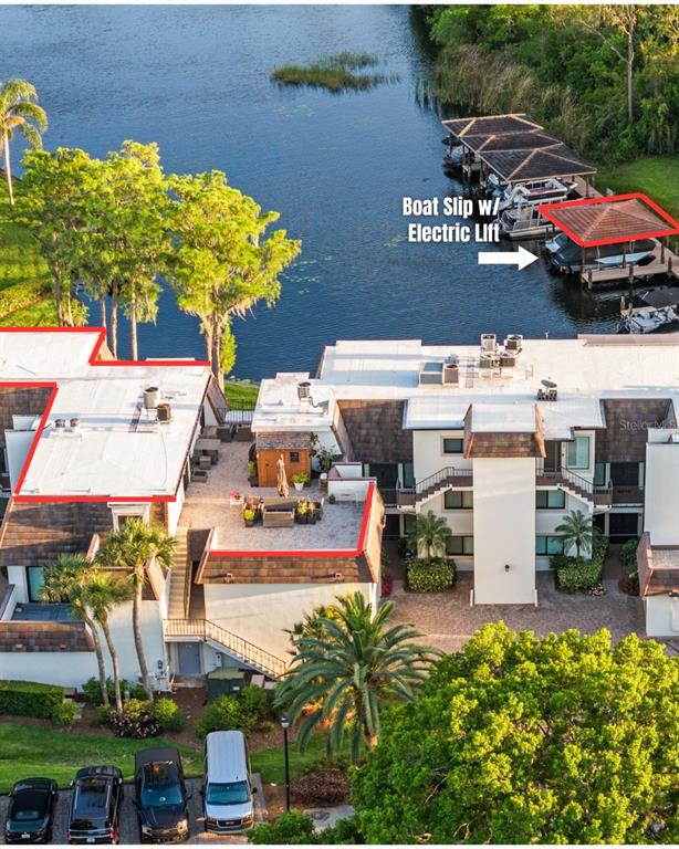 6206 Masters Boulevard, Unit 302 Orlando, FL 32819 - Photo 22 of 32 an aerial view of residential houses with outdoor space