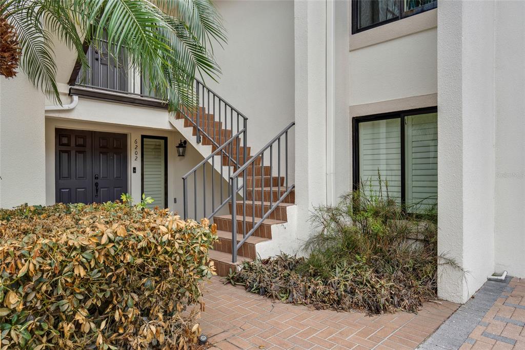 6206 Masters Boulevard, Unit 302 Orlando, FL 32819 - Photo 26 of 32 a view of a house with a small garden