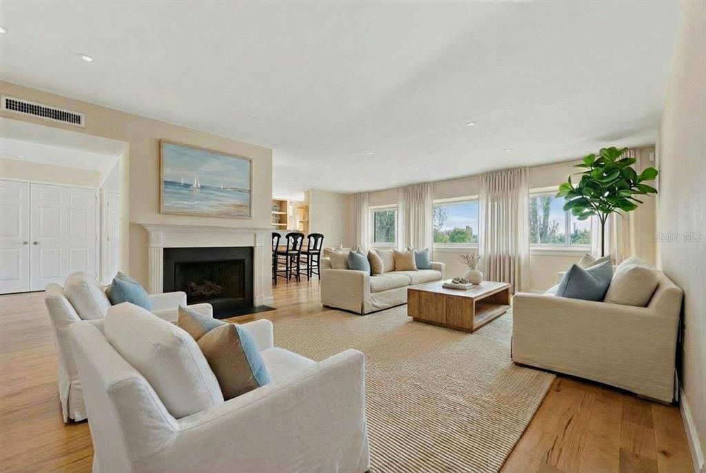 6206 Masters Boulevard, Unit 302 Orlando, FL 32819 - Photo 3 of 32 a living room with furniture and a fireplace
