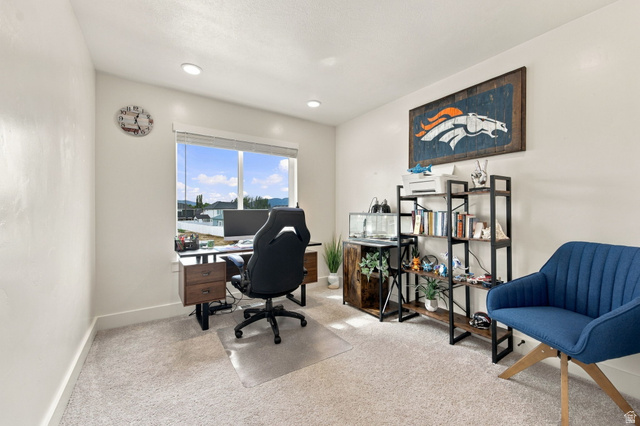 1566 Silver Canoe Loop Logan, UT 84321 - Photo 31 of 44 Recessed lighting, large window, and light-toned carpeting