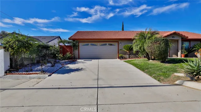 a front view of a house with yard