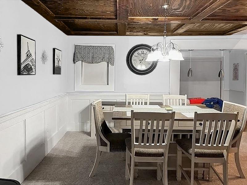 205 Stone Church Road Grindstone, PA 15442 - Photo 12 of 25 a view of a dining area with furniture and a clock