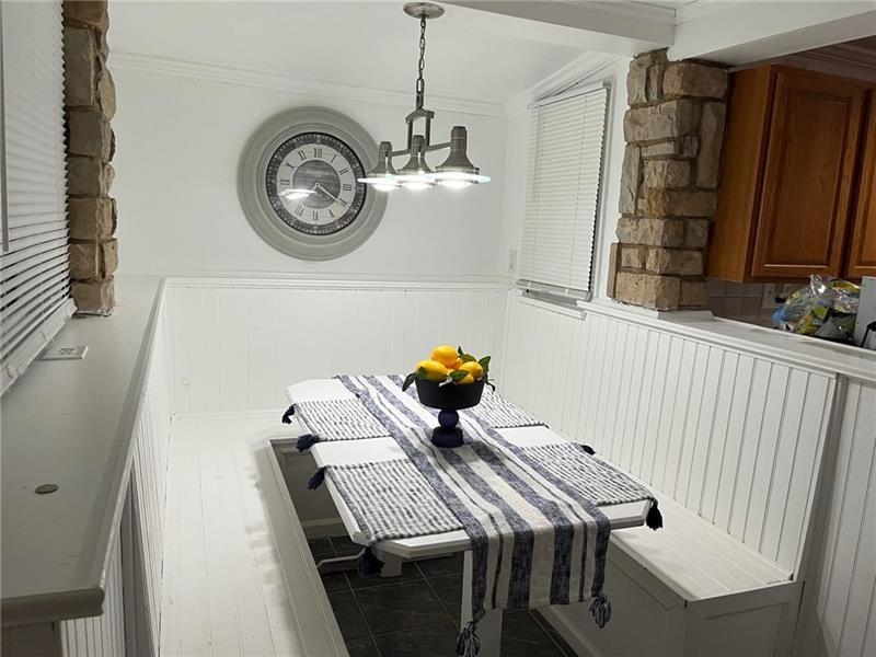 205 Stone Church Road Grindstone, PA 15442 - Photo 24 of 25 a view of a dining room with furniture and wooden floor