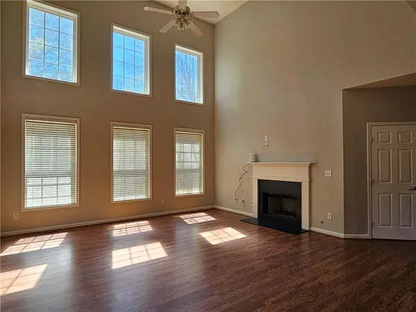 a view of front door with wooden floor and stairs