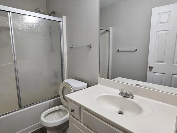 a view of an entryway with wooden floor